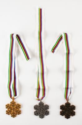 Lot #4067 Aleksei Grishin's FIS Freestyle World Ski Championships Gold, Silver, and Bronze Winner's Medals - Image 1