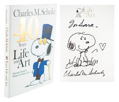 Lot #425 Charles Schulz Signed Book with Snoopy Sketch