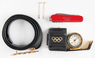 Lot #6384 Olympic Souvenirs: Belt, Travel Clock, Swiss Army Knife, and 18k Gold Lapel Pins - Image 1