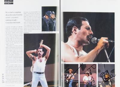 Lot #3453 Live Aid Multi-Signed Book with Queen, David Bowie, Elton John, and more