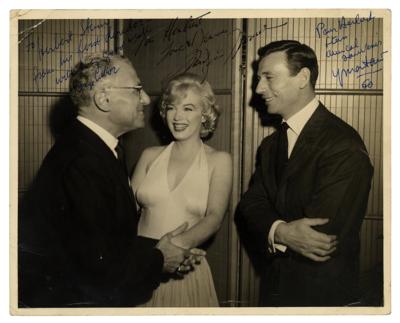 Lot #471 Marilyn Monroe Signed Photograph with George Cukor and Yves Montand - Image 1