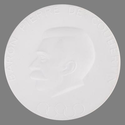 Lot #3355 Munich 1972 Summer Olympics 'Pierre de Coubertin' Porcelain Medallion by Meissen - Image 1