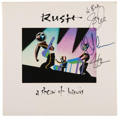 Lot #673 Rush Signed Album - A Show of Hands - Image 1