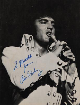 Lot #702. Elvis Presley Signed 'Tour Photo Album’ Program (1972)