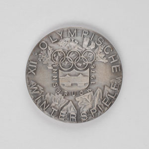 Lot #9098 Innsbruck 1976 Winter Olympics Silvered Bronze Participation Medal - Image 1