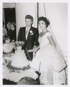 Lot #9183 John and Jacqueline Kennedy 1953 Wedding Photograph Cutting Cake - Image 1