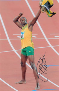 Lot #3235 Usain Bolt Signed Photograph - Image 1