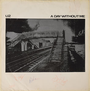 Lot #4276  U2 Signed 'A Day Without Me' 45 RPM Sleeve - Image 1