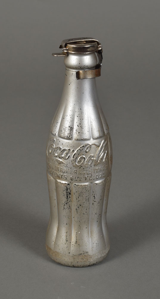 Lot #7065 Andy Warhol 'You're In' Silver Coca-Cola Bottle With Holder