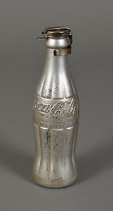 Lot #7065 Andy Warhol 'You're In' Silver Coca-Cola Bottle With Holder - Image 1