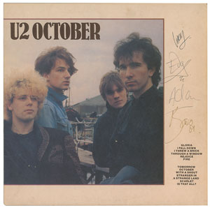Lot #4669  U2 Signed Album - Image 1