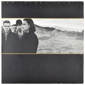 Lot #4672  U2 Signed Album - Image 1