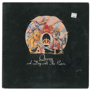 Lot #4615  Queen: May and Taylor Signed Album - Image 1