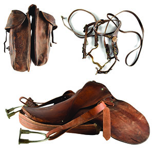 Lot #7064  Old Tucson Studios Tack Collection: Leather Saddle, Saddle Bags, and Bridle - Image 1