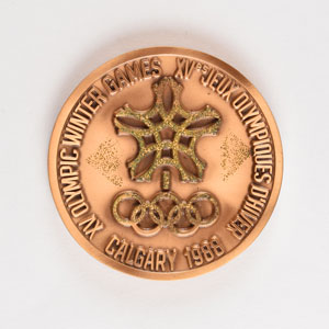 Lot #8392  Calgary 1988 Winter Olympics Bronze Participation Medal - Image 1