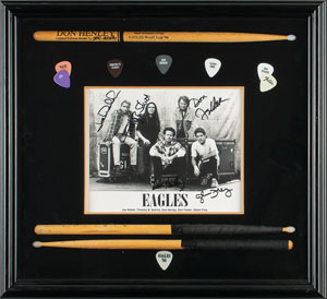 Lot #9206 The Eagles Signed Photograph and Stage-Used Drum Sticks - Image 1