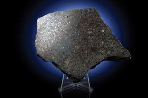 Lot #2455  Northwest Africa (NWA) 869 Meteorite Half Stone - Image 1