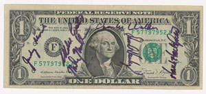 Lot #4409  STS-41-D Signed Dollar Bill - Image 1