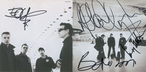 Lot #5496  U2 Signed CD Booklet