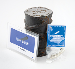 Lot #3398 Al Worden's Blue Origin Flown Pin, Vehicle Access Tower Artifact, and Badge