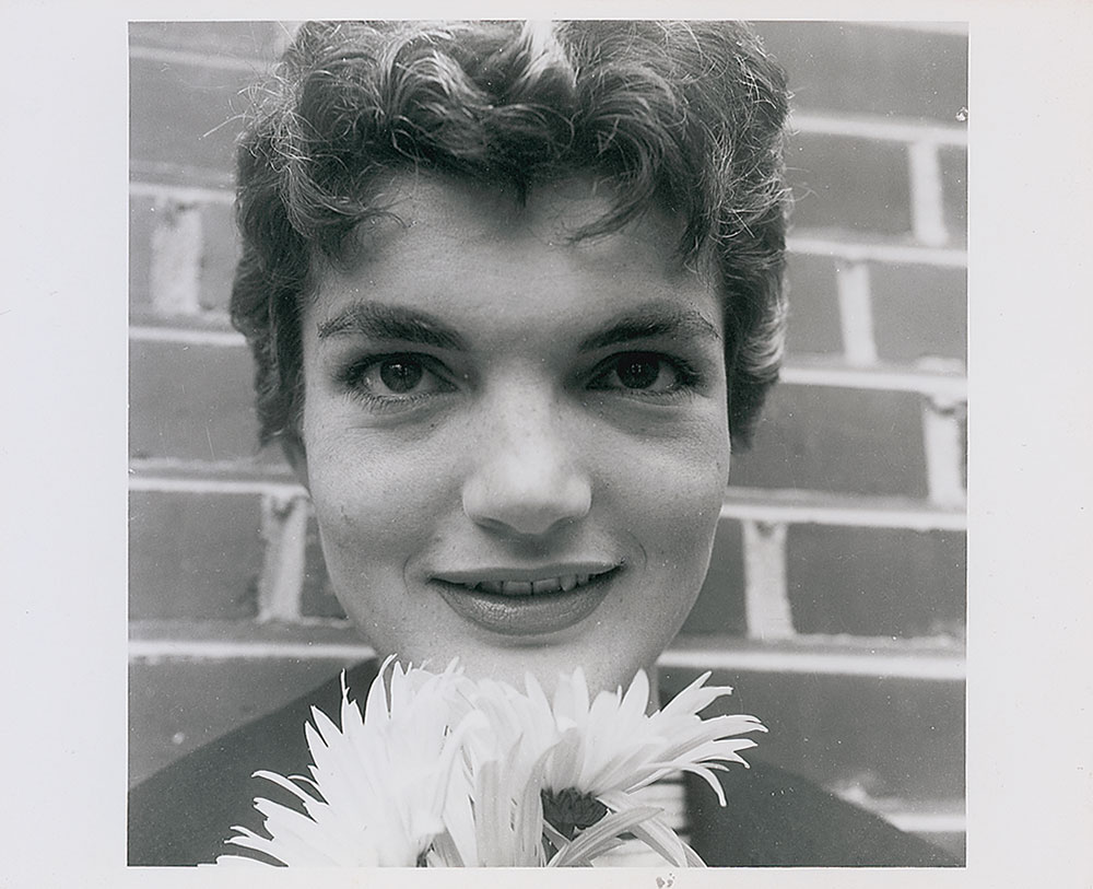 Lot #39 Jacqueline Kennedy Posing with a Flower in