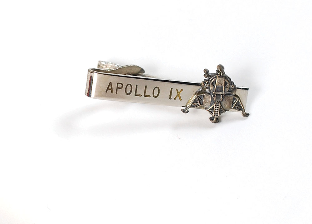 Lot #133 Jim McDivitt’s Apollo 9 Flown Grumman Tie Clip