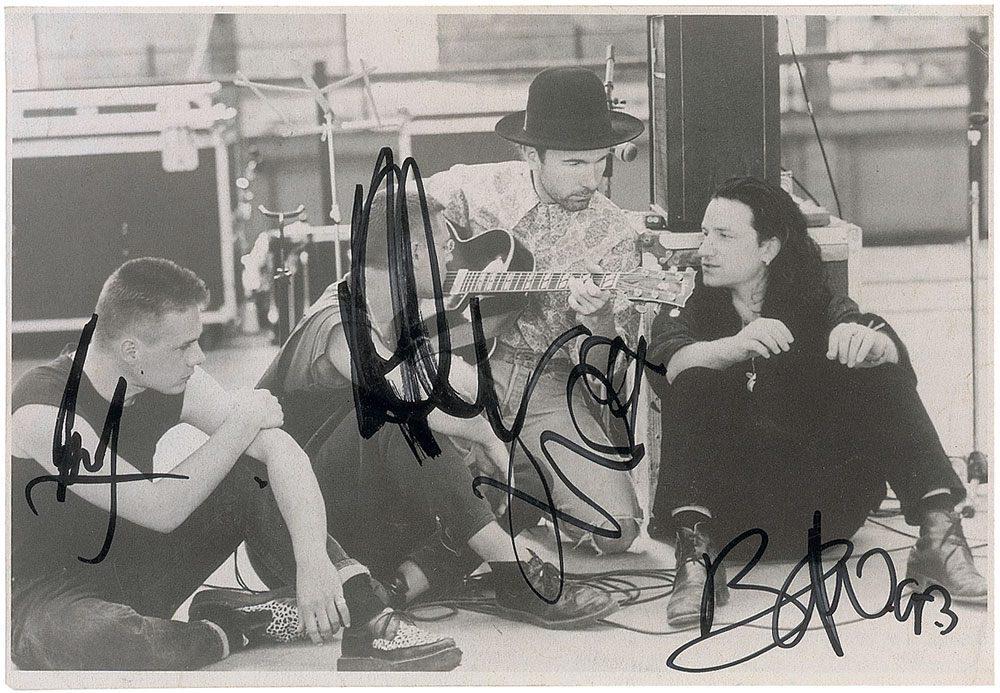 Lot #7512 U2 Signed Photograph